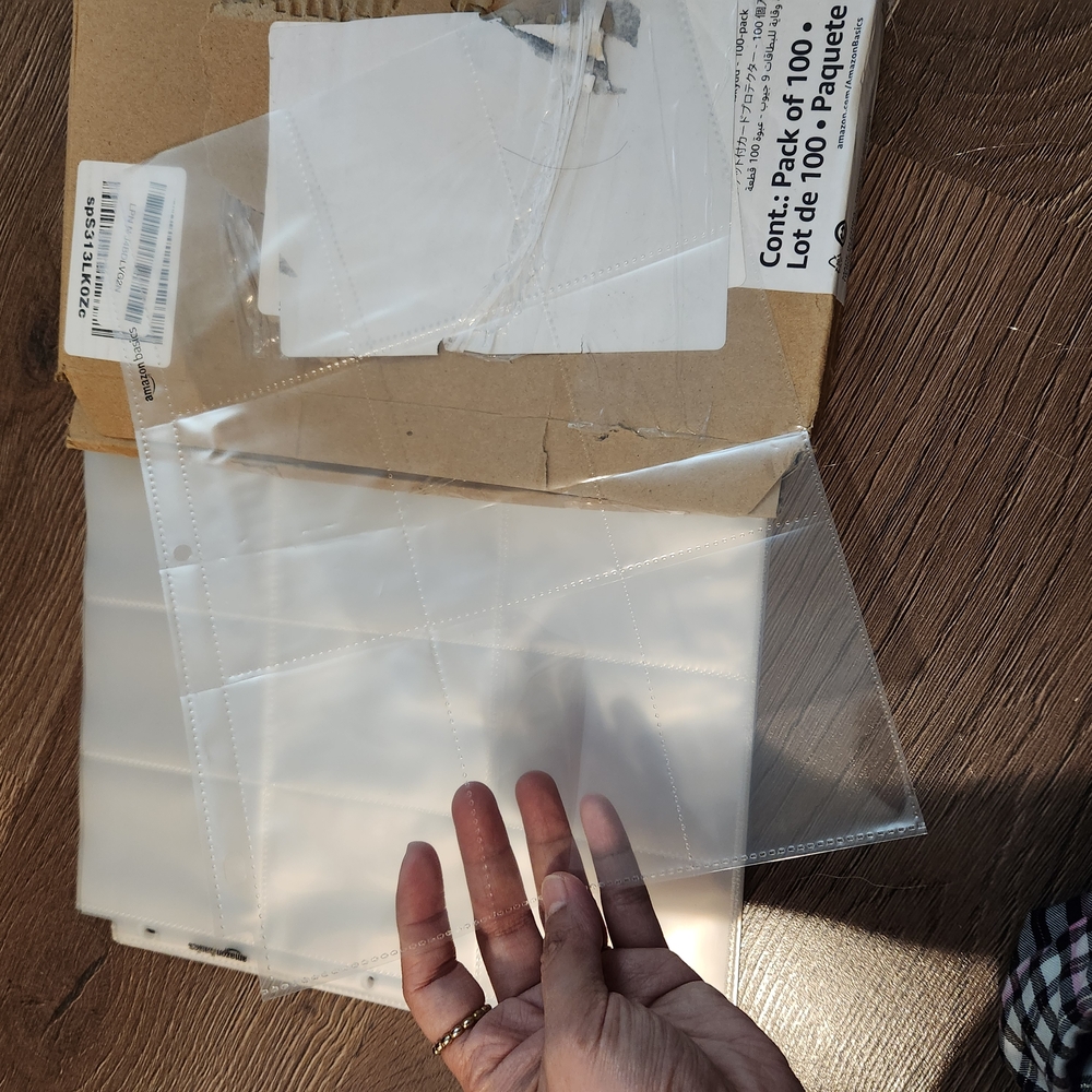 Amazon Basics 9 Sleeve Card Protectors Binder Sheet for Secure Card Storage, 100